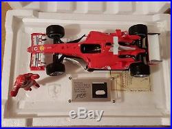Michael Schumacher 118 Ferrari with piece of actual race suit and signed COA